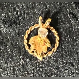 Women’s Gold Pendant Round Braid With A Leaf And A Diamond Gemstone In Center